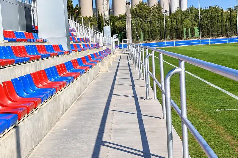 Aisle in the mini-stadium stand with blue and claret seats