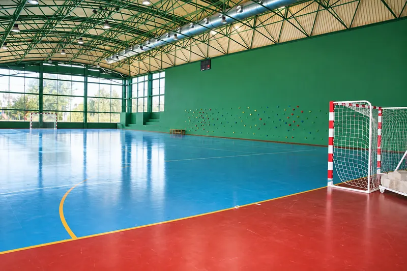 Futsal court in the covered sports hall, with a blue and red floor