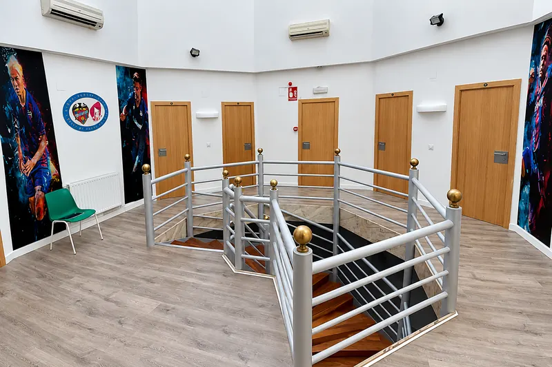 Landing in the bedroom area with posters of footballers