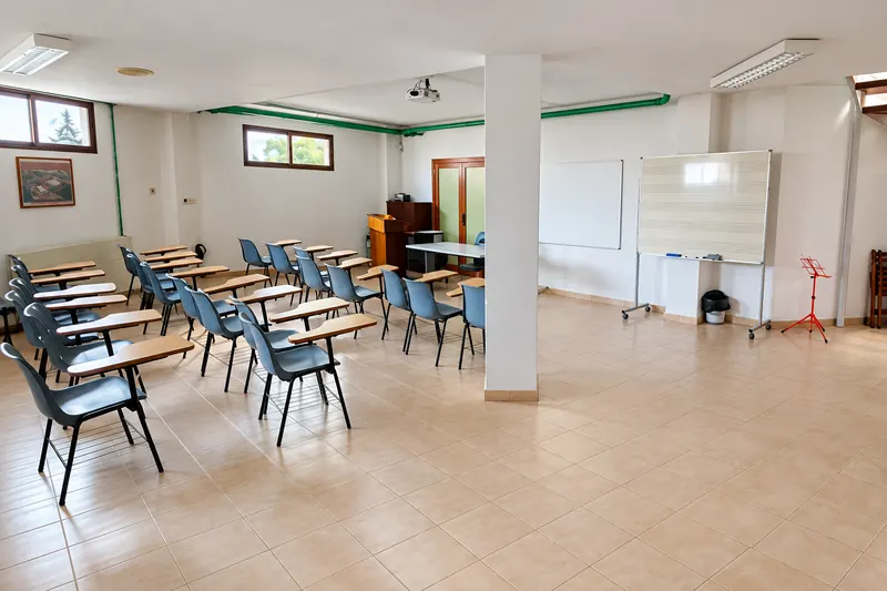 Lounge with desks, a whiteboard and plenty of natural light